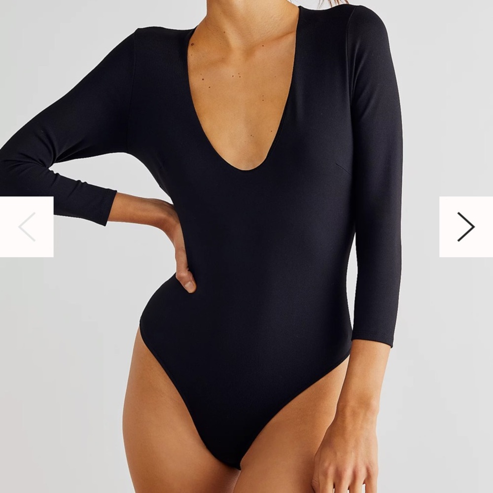 Free people black thong body suit with plunging neckline.